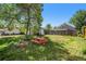 Spacious backyard featuring a fire pit, picnic table and shade tree at 3685 S Hooker St, Englewood, CO 80110