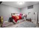 Bedroom featuring a bed with built-in storage, and a large window offering plenty of natural light at 3685 S Hooker St, Englewood, CO 80110