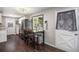 Open dining area leads to a kitchen with stainless steel appliances and a backyard door at 3685 S Hooker St, Englewood, CO 80110