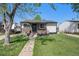 Charming single-story home with landscaped front yard and stone accents at 3685 S Hooker St, Englewood, CO 80110
