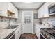 Updated kitchen features stainless steel appliances, modern countertops, and ample cabinet space at 3685 S Hooker St, Englewood, CO 80110