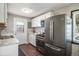 Well-equipped kitchen features stainless steel appliances and white marble countertops at 3685 S Hooker St, Englewood, CO 80110
