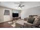 Inviting living room showcases a modern TV and a comfy gray sectional sofa at 3685 S Hooker St, Englewood, CO 80110