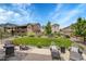 Spacious backyard with patio seating, lush greenery, and scenic neighborhood views at 8839 Culebra St, Arvada, CO 80007