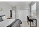 Cozy bedroom with a plush bed, natural light and a functional desk area at 8839 Culebra St, Arvada, CO 80007