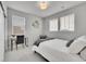 Sunlit bedroom featuring neutral paint, carpet, and decor with a functional desk at 8839 Culebra St, Arvada, CO 80007
