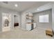 Bright bonus room featuring a beverage bar, shelving, and neutral decor perfect for entertaining at 8839 Culebra St, Arvada, CO 80007