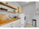 Efficient laundry room with a folding table and ample storage at 8839 Culebra St, Arvada, CO 80007