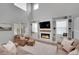 Inviting living area with a cozy fireplace, custom built-ins, and plush seating, creating a comfortable and stylish ambiance at 8839 Culebra St, Arvada, CO 80007