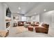 Spacious living room with leather furniture, a fireplace, and a cozy rug at 8839 Culebra St, Arvada, CO 80007