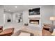 Open living space with a fireplace feature wall and cozy seating at 8839 Culebra St, Arvada, CO 80007
