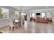 Open-concept living space featuring a dining area, living room, and sliding glass doors to the outdoor space at 8839 Culebra St, Arvada, CO 80007
