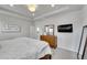 Spacious main bedroom with a tray ceiling, dresser, and ensuite bathroom entrance at 8839 Culebra St, Arvada, CO 80007