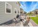 Relaxing patio with comfortable seating, a grill, and a view of the fenced yard at 8839 Culebra St, Arvada, CO 80007
