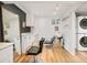 Finished basement with hair salon, stacked laundry, and ample lighting at 3025 S Norman Ct, Denver, CO 80224