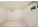 Bright bedroom with neutral carpet, two windows offering natural light, and fresh paint at 3025 S Norman Ct, Denver, CO 80224