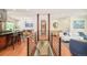 Open floor plan showcases hardwood floors, dining room, and living room at 3025 S Norman Ct, Denver, CO 80224