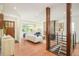 Stylish living room with hardwood floors, slate fireplace, and a staircase with iron railings at 3025 S Norman Ct, Denver, CO 80224