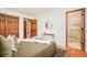 Inviting main bedroom with ensuite bathroom and wooden accents at 3025 S Norman Ct, Denver, CO 80224