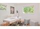 Bright office with large windows, white desk, modern decor, and hardwood floors at 3025 S Norman Ct, Denver, CO 80224