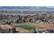 Overhead image of a school athletic field in a neighborhood setting, with snow-capped mountains in the background at 1070 Milo Cir # B, Lafayette, CO 80026