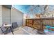 Fenced-in backyard patio with outdoor seating and charming string lights at 1070 Milo Cir # B, Lafayette, CO 80026