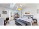 Bright bedroom features skylights, a large bed, and tasteful decor at 1070 Milo Cir # B, Lafayette, CO 80026