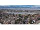 View of the neighborhood and distant lake with snow-capped mountains, blending natural beauty with suburban living at 1070 Milo Cir # B, Lafayette, CO 80026