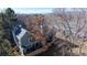 View of the back of the home, showing a cozy patio, privacy fence, and a well-maintained roof at 1070 Milo Cir # B, Lafayette, CO 80026