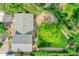 Aerial view of home showcasing roof, backyard with mature tree, patio, and landscaping in a peaceful neighborhood at 962 S Potomac Way, Aurora, CO 80012