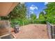 Fenced backyard featuring gravel, a grill, and lush foliage at 962 S Potomac Way, Aurora, CO 80012