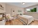 Cozy bedroom features a full-length mirror and bright natural light at 962 S Potomac Way, Aurora, CO 80012