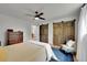 Spacious bedroom featuring hardwood floors, barn door closet, and blue accent rug at 962 S Potomac Way, Aurora, CO 80012