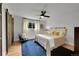 Bright bedroom with hardwood floors, barn door closet and a comfortable bed at 962 S Potomac Way, Aurora, CO 80012
