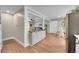 Open-concept space features a dining area and bar seating, seamlessly connecting to the living room at 962 S Potomac Way, Aurora, CO 80012