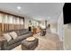 Spacious basement living room with kitchenette and comfortable seating arrangement at 962 S Potomac Way, Aurora, CO 80012