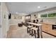 Finished basement living room with a kitchenette and comfortable seating area at 962 S Potomac Way, Aurora, CO 80012