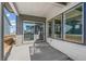 Covered back porch with sliding glass doors and view of the backyard at 21234 E 63Rd Dr, Aurora, CO 80019