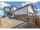 Two-story home featuring stone accents, a two car garage and professionally landscaped yard at 21234 E 63Rd Dr, Aurora, CO 80019