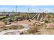Community playground featuring slides built into a hillside and a walking path at 21234 E 63Rd Dr, Aurora, CO 80019