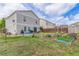 Large backyard with flowers, a shed, and privacy fence, great for outdoor activities at 249 Vista Blvd, Brighton, CO 80603