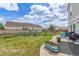 Inviting backyard with patio, potted plants, and outdoor seating, perfect for relaxation at 249 Vista Blvd, Brighton, CO 80603