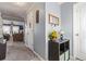 Welcoming entryway featuring neutral paint, tiled floors, and providing a glimpse into the living room at 249 Vista Blvd, Brighton, CO 80603