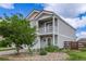 Charming two-story home featuring a balcony, well-maintained yard, and appealing curb appeal at 249 Vista Blvd, Brighton, CO 80603