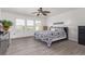 Spacious main bedroom with wood-look floors, large windows, and abundant natural light at 249 Vista Blvd, Brighton, CO 80603