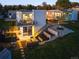 Modern home featuring hot tub, outdoor seating, and landscaped backyard with deck at 5969 S Humboldt Ct, Centennial, CO 80121