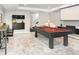 Spacious game room with pool table, bar and large screen at 5969 S Humboldt Ct, Centennial, CO 80121