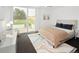 Bright, airy bedroom with a sliding glass door, neutral tones, and stylish decor at 5969 S Humboldt Ct, Centennial, CO 80121