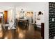 Open dining area with stylish lighting, modern art, and direct access to a sunlit patio at 5969 S Humboldt Ct, Centennial, CO 80121