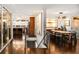 Open dining room features a modern chandelier, sleek dining table, and hardwood flooring throughout at 5969 S Humboldt Ct, Centennial, CO 80121
